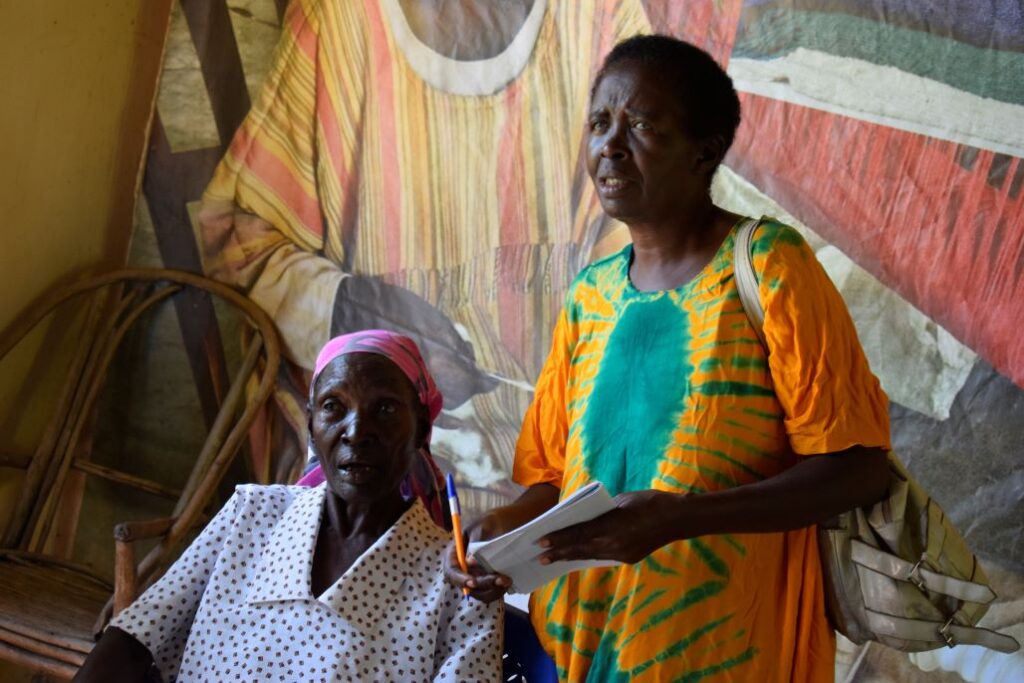 Empowering Through Craft: A Pendeza weaving trainer guides a student through the intricate art of hand-weaving, fostering skill development and empowerment.